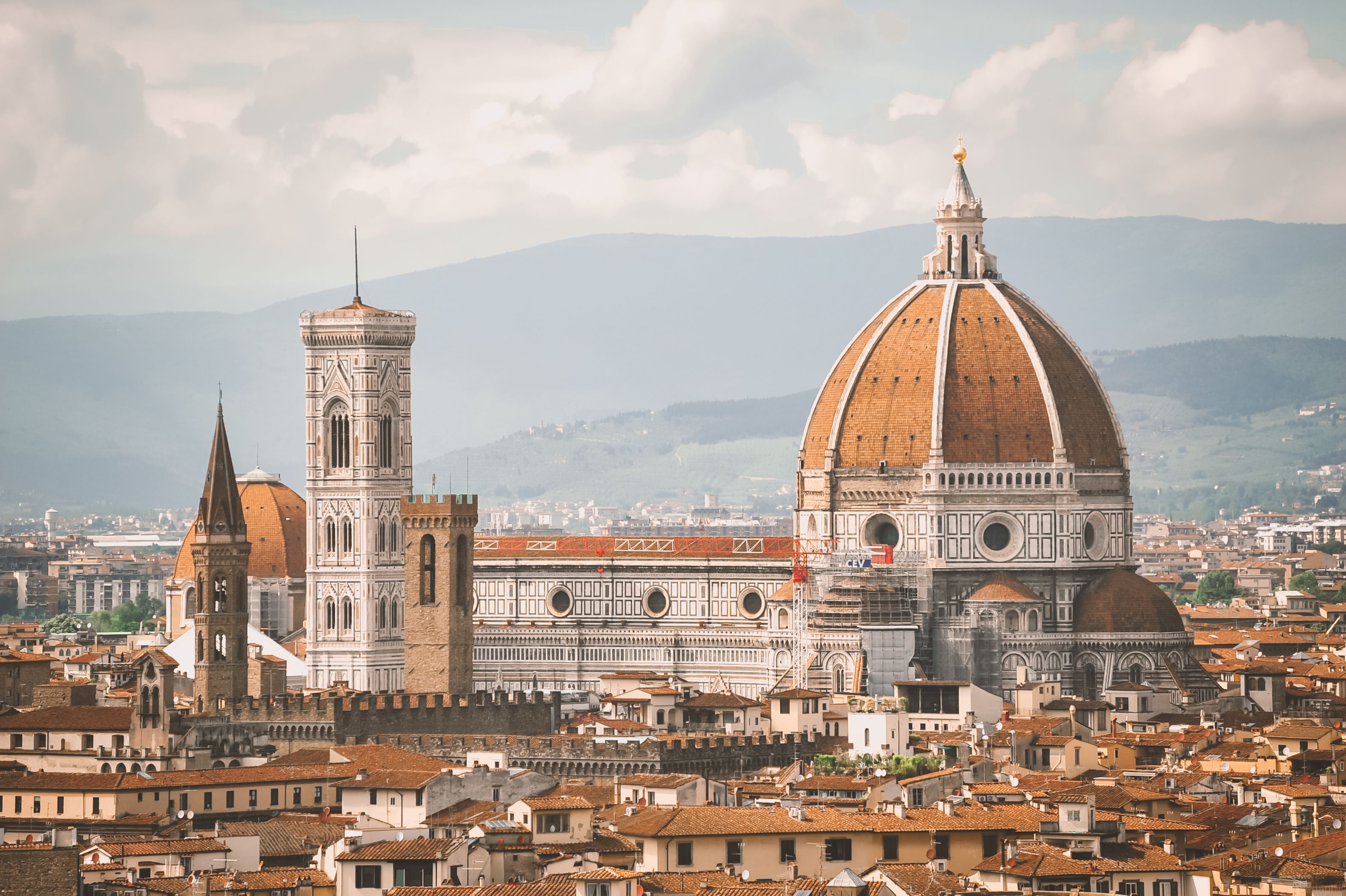 The cathedral dome and bell tower above the rooftops of Florence